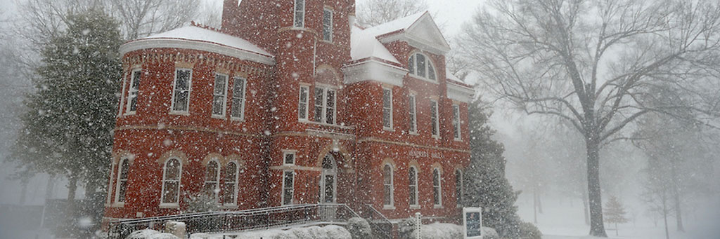 a very snowy day in front of Ventress Hall